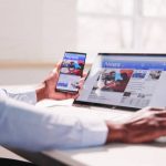 Watching News On Screen. Reading Newspaper Website On Laptop