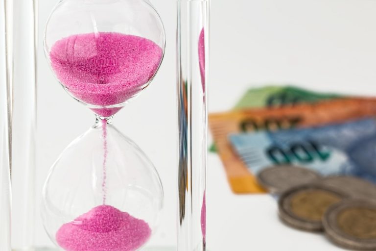 Hourglass, money, time — Best Instant Funding Prop Firms for Traders Ready to Accelerate Their Trading Journey
